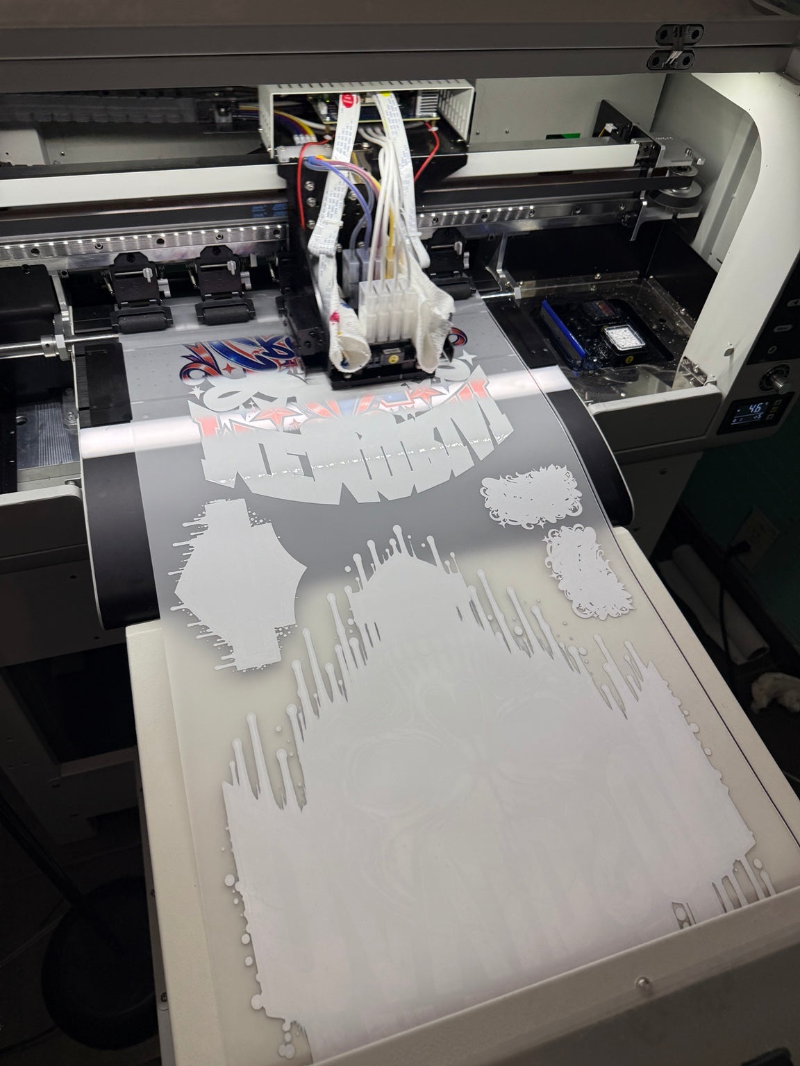 DTF printer laying down white ink on transfer film
